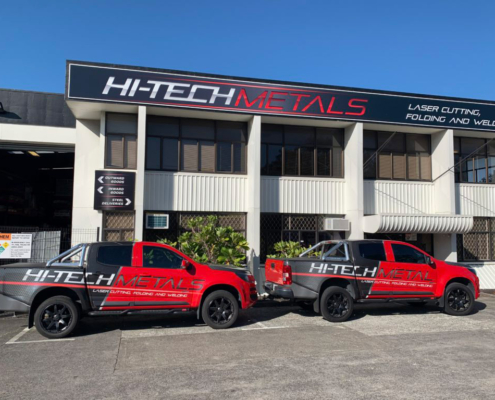 Image showing two of Hi-Tech Metal's delivery vehicles - Holden utes.